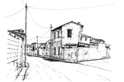 Strada con case in mattoni crudi - Via Santa Chiara a San Gavino Monreale